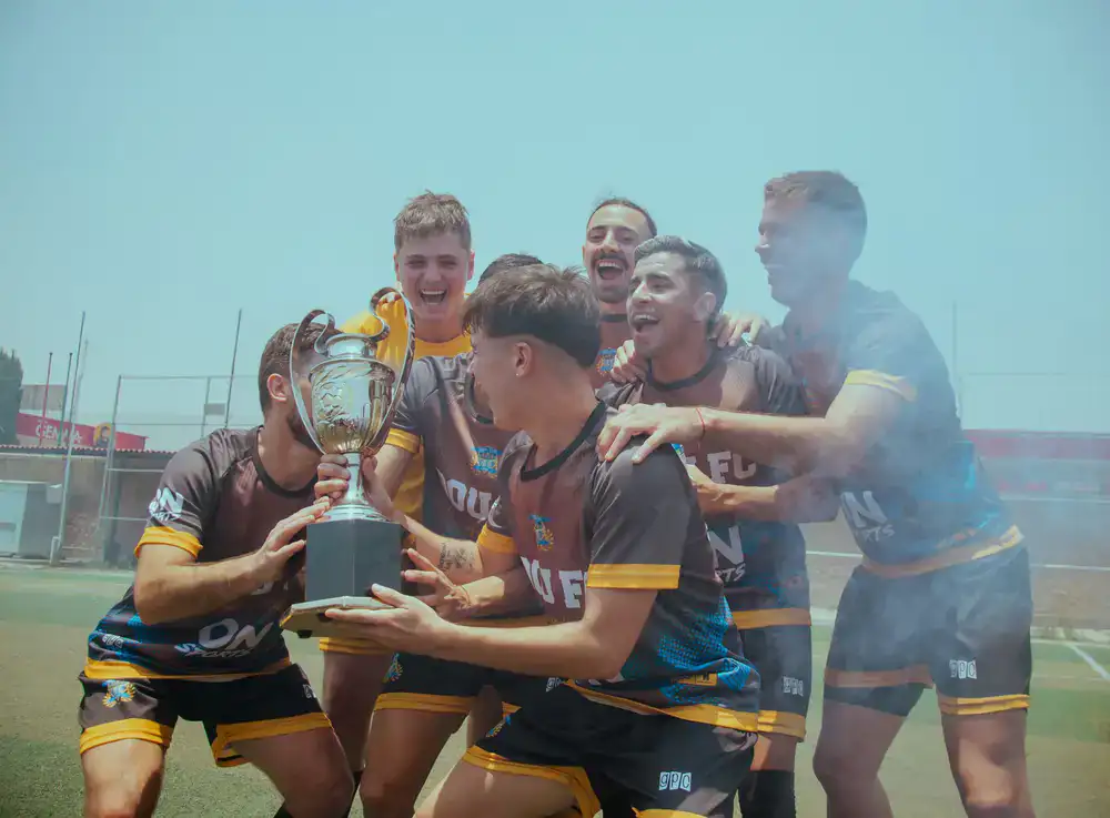 Player lifting MVP trophy
